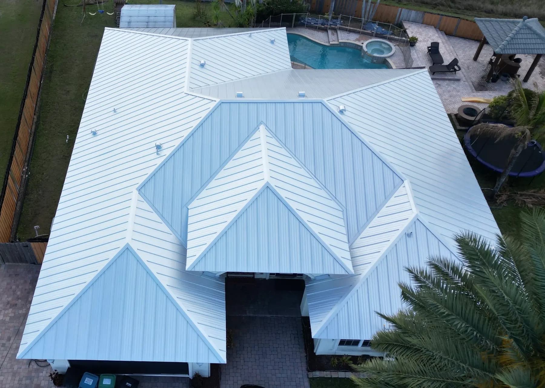 Light standing-seam metal roof on a Florida residence